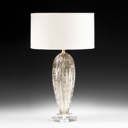 Clear and gold Venetian glass table lamp with white shade.