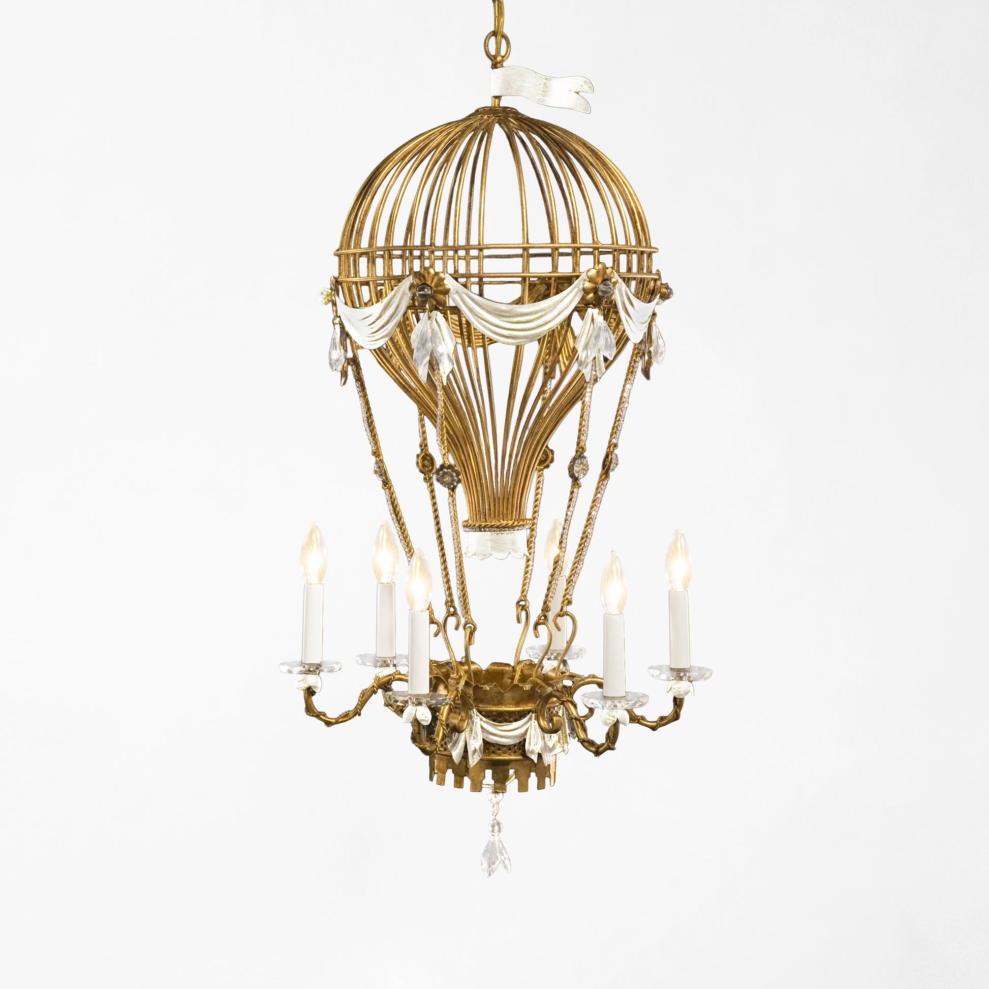 Gold hot air balloon chandelier with white details.