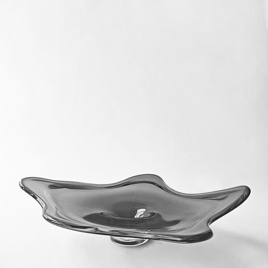 Gray glass decorative platter with modern design.