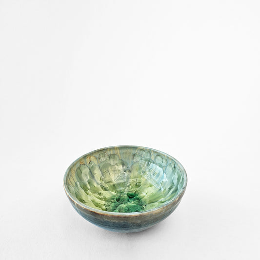 Green ceramic bowl with crystal glaze.