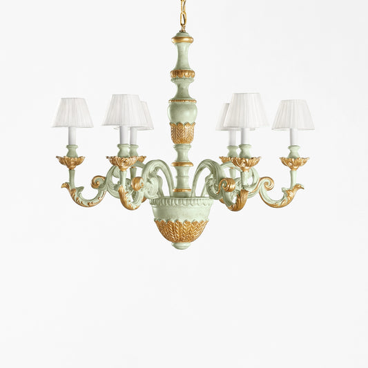 Traditional light green chandelier with gold details and pleated shades.