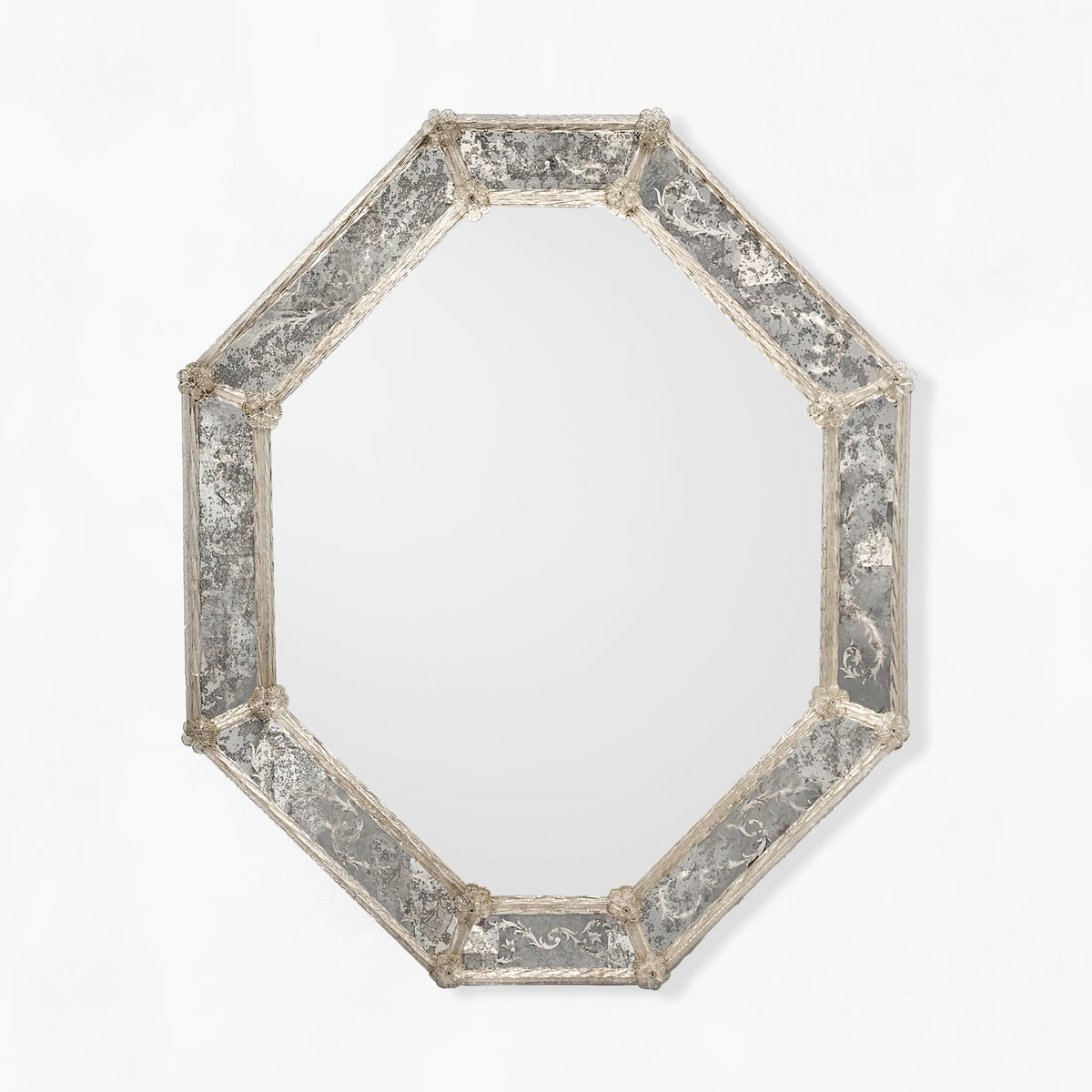 Octagonal Venetian glass mirror with antique frame.