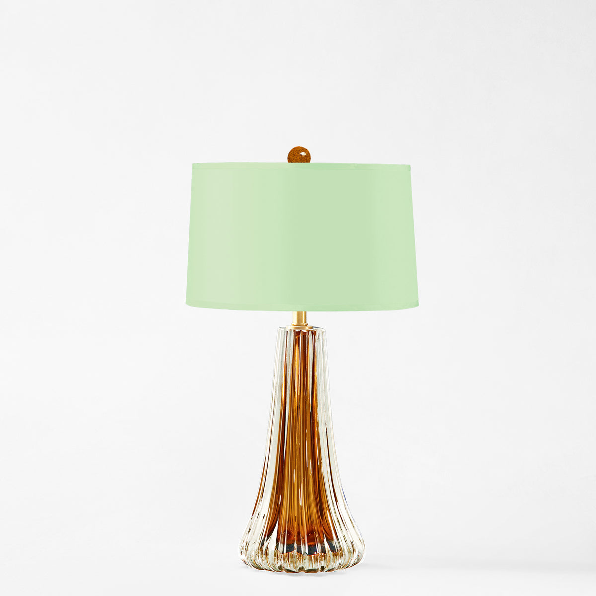 Amber Murano glass table lamp with green lamp shade.