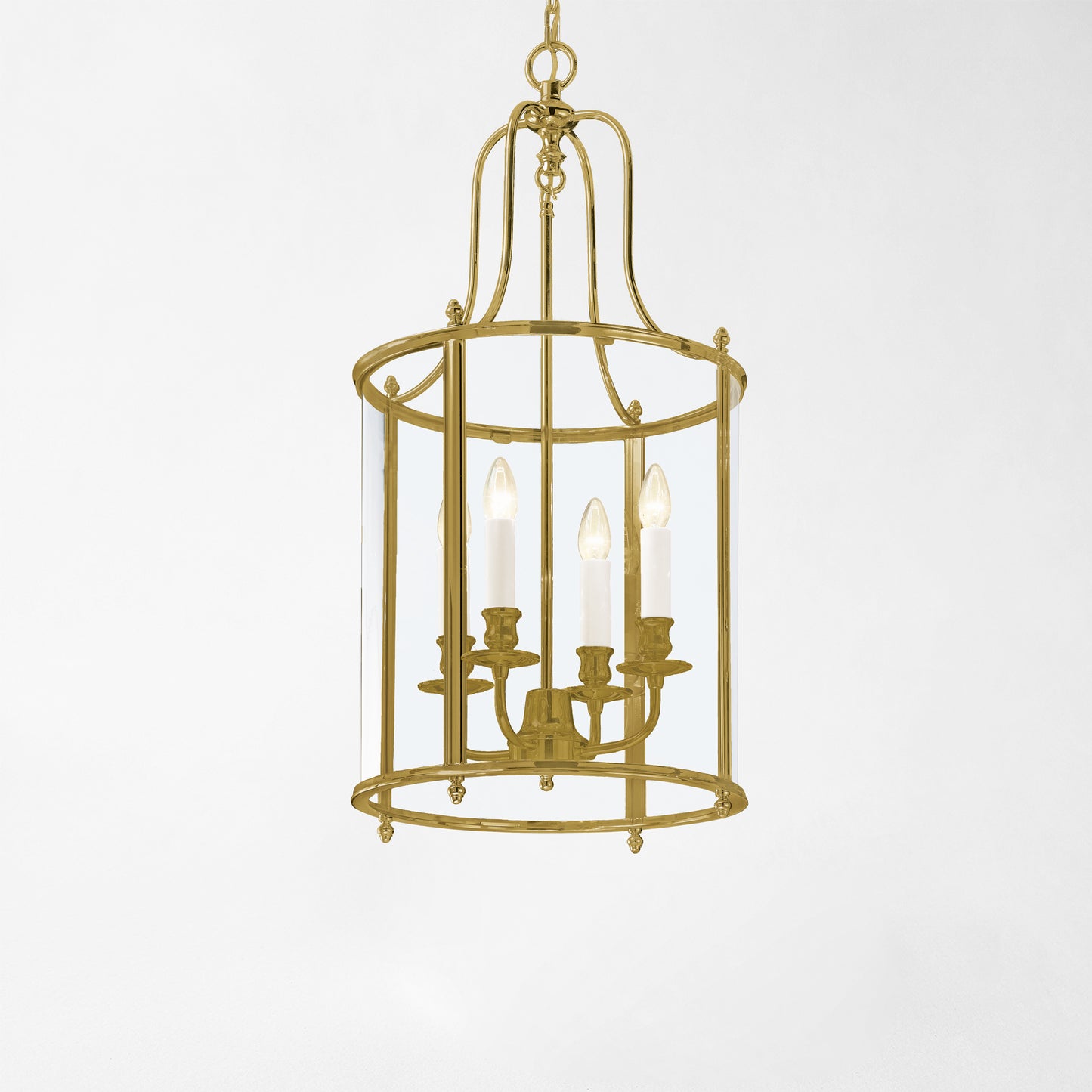 An antique brass lantern with glass panels.