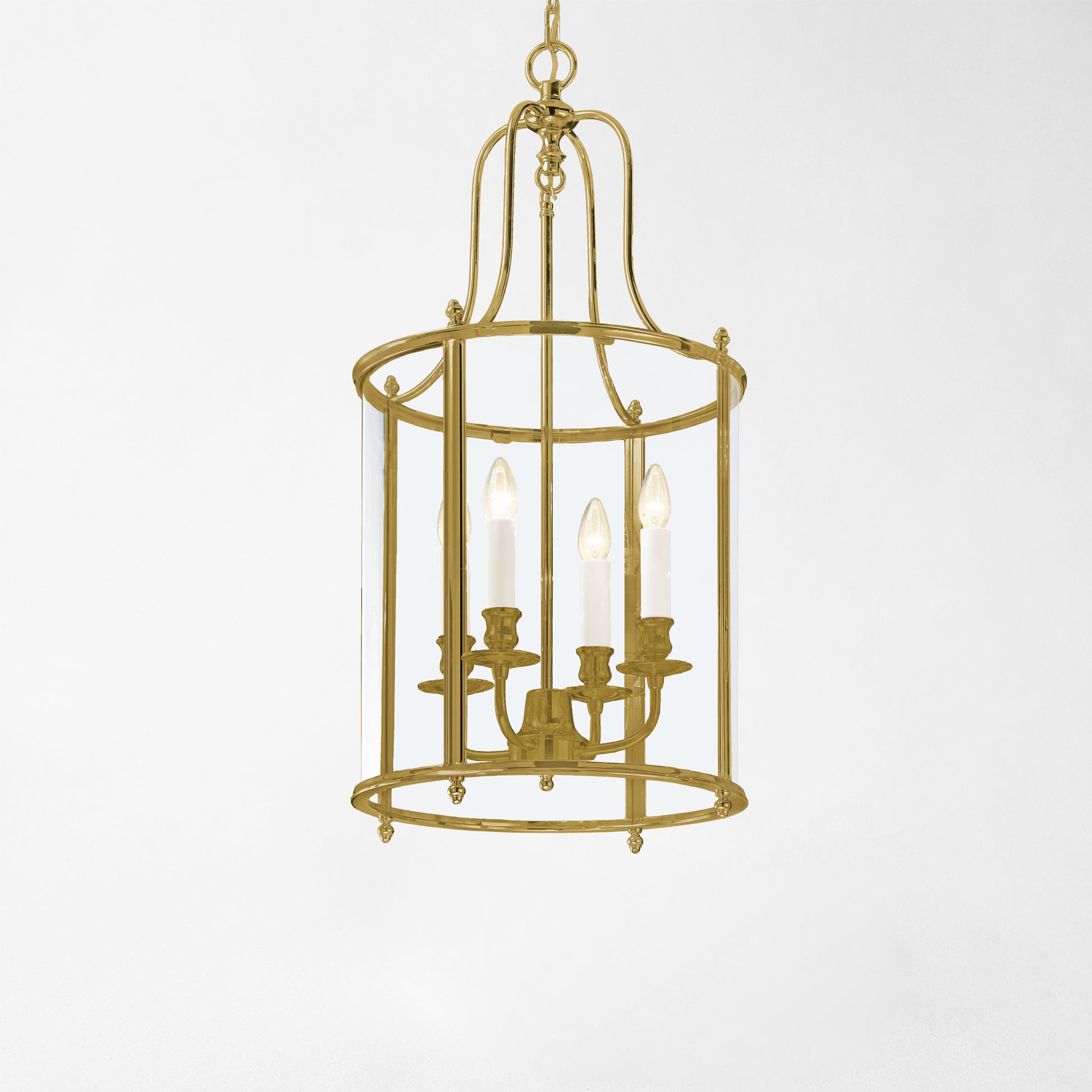 An antique brass lantern with glass panels.