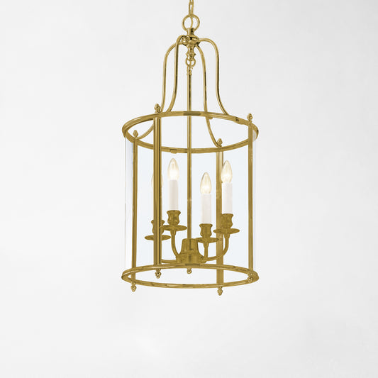 An antique brass lantern with glass panels.