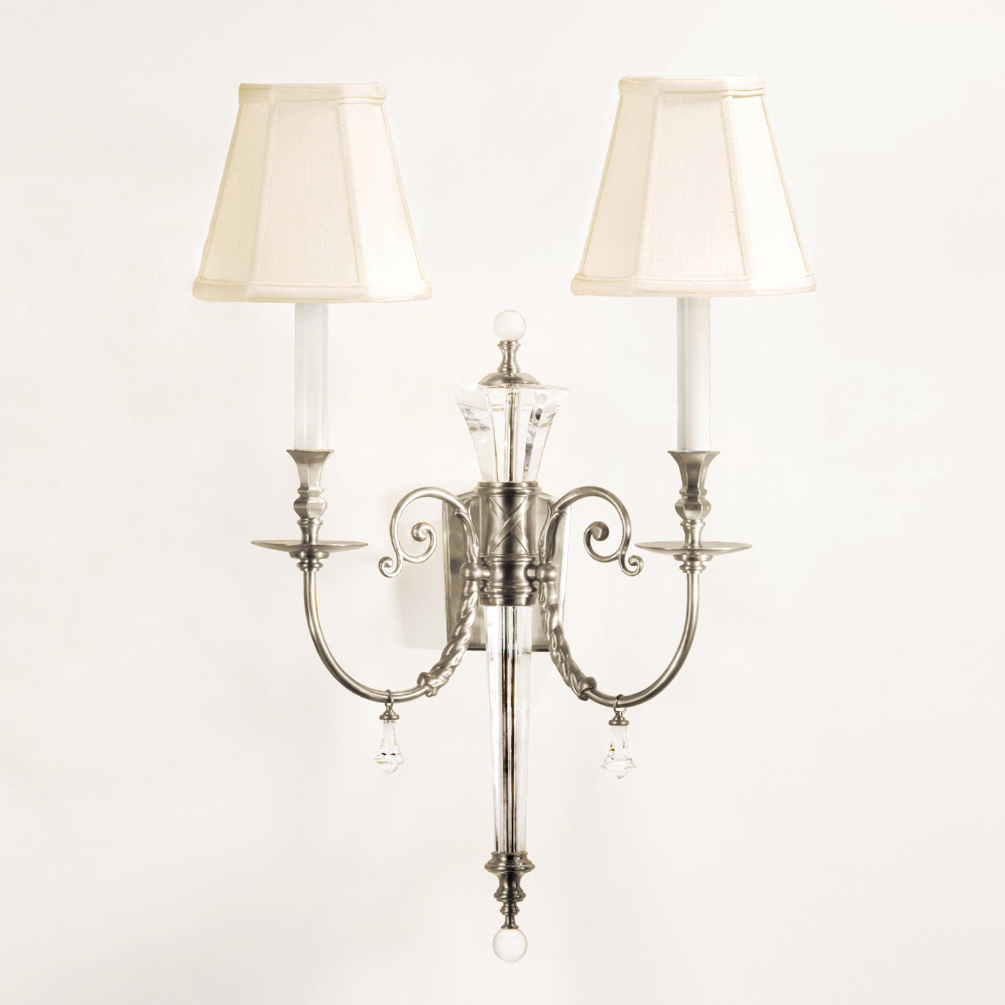 Crystal and polished nickel wall sconce.