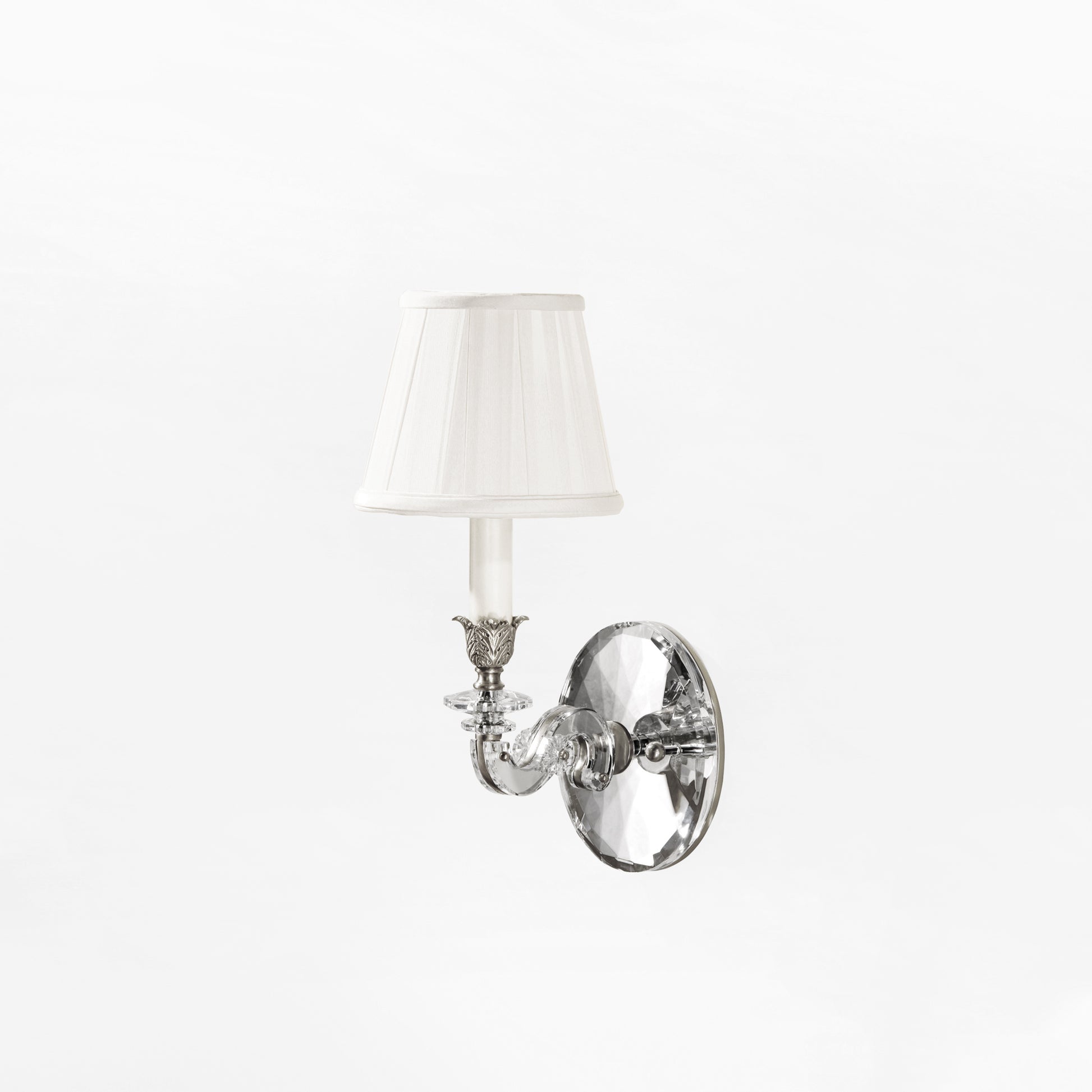 Nickel and crystal sconce with pleated shade.