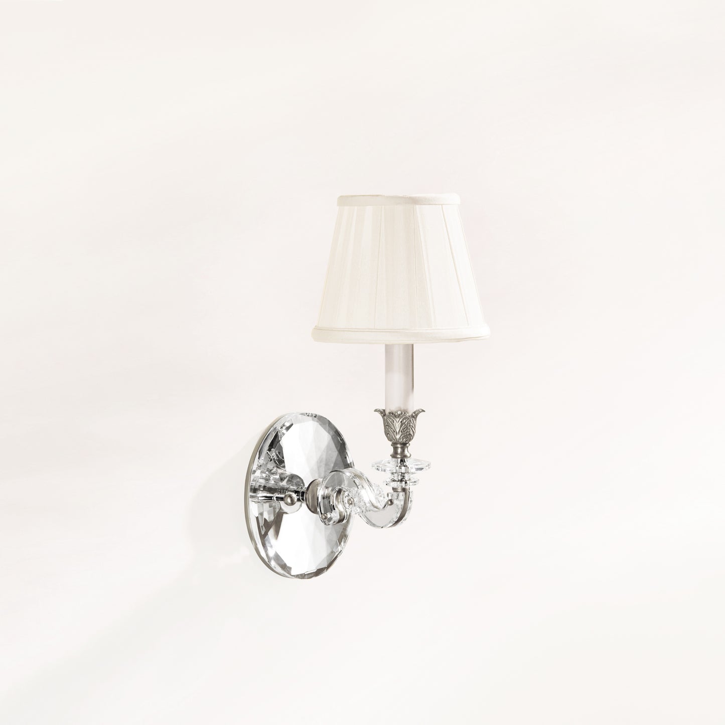 Crystal and polished nickel wall sconce with traditional pleated shade.
