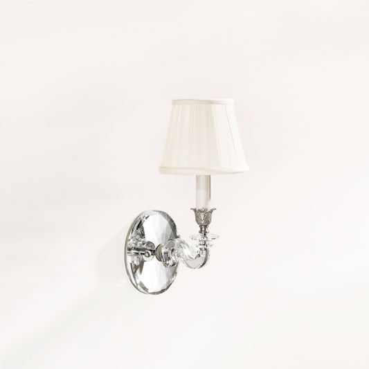 Crystal and polished nickel wall sconce with traditional pleated shade.