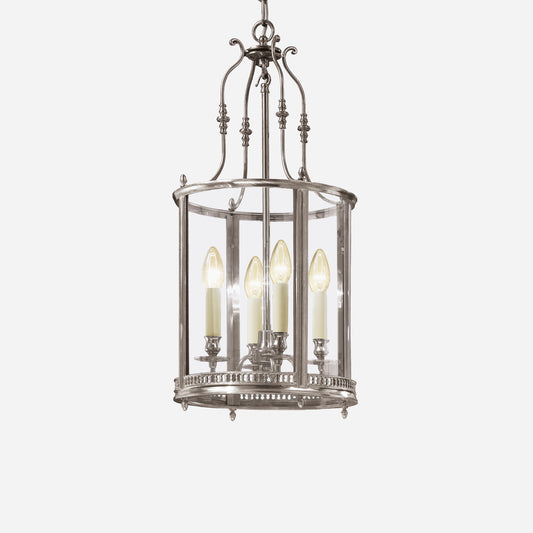 Antiqued silver lantern with glass.