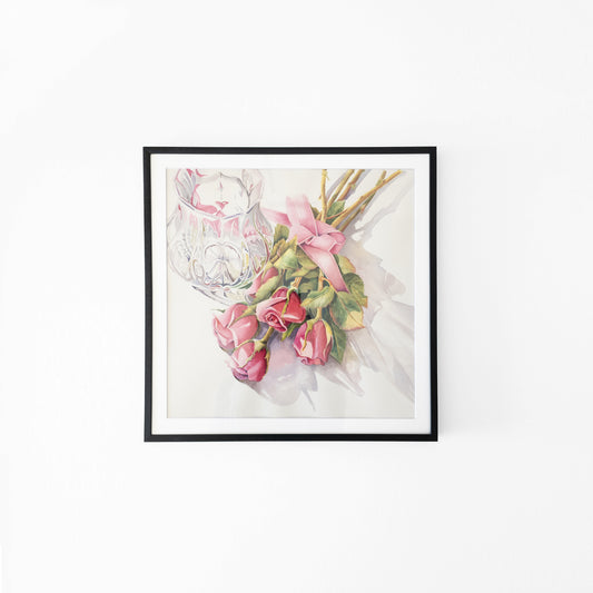 Watercolor painting of pink roses with a crystal vase in a black frame.