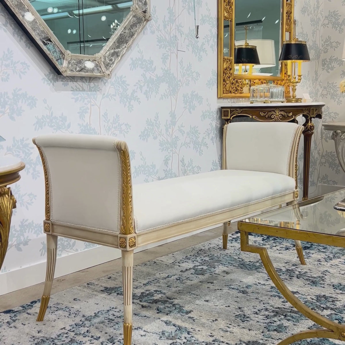 A white and gold Italian bench