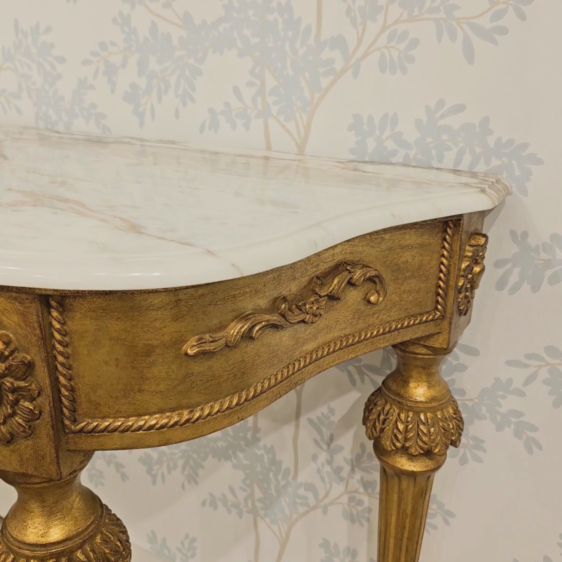 Italian gold console with white marble top.