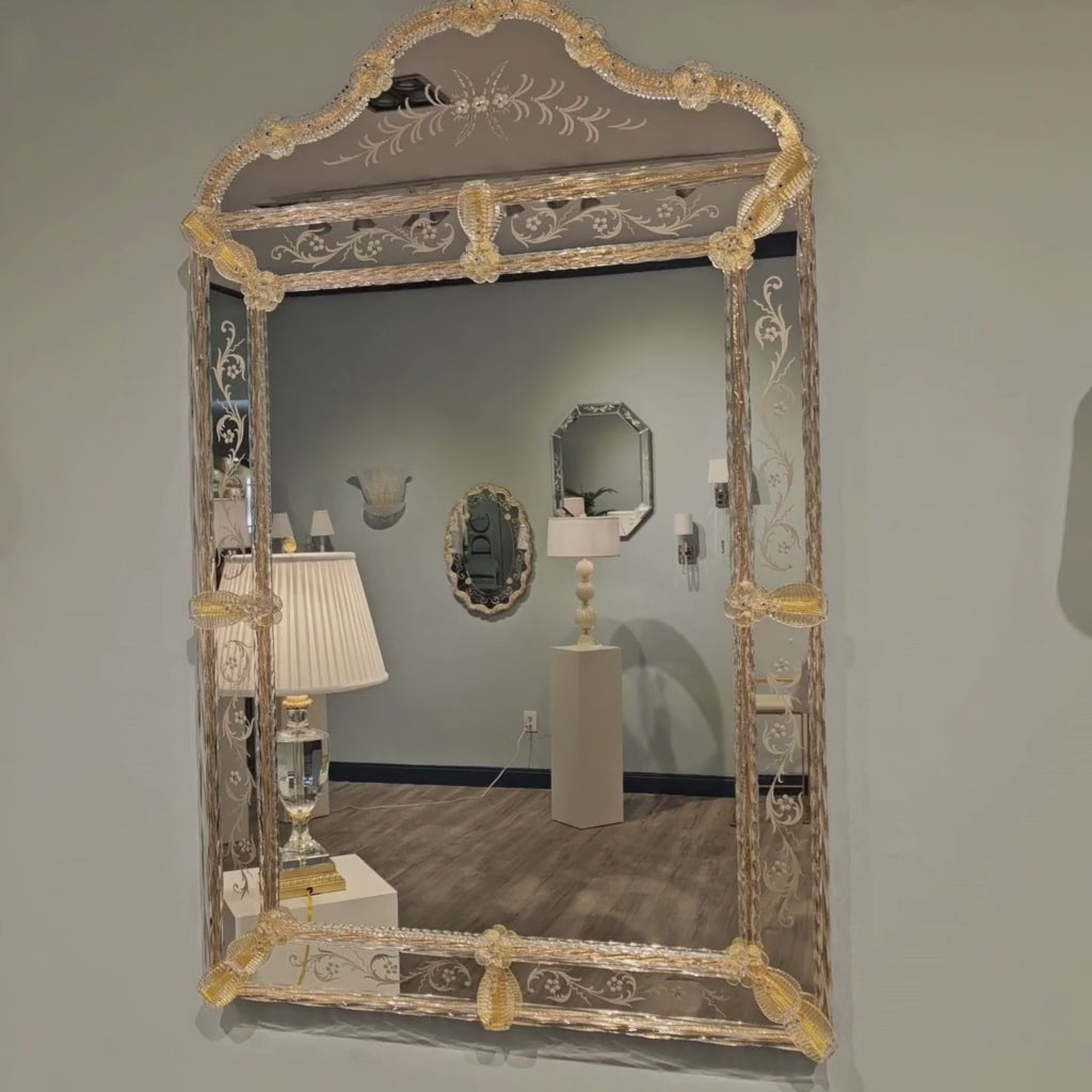 Closeup of gold Murano glass mirror.