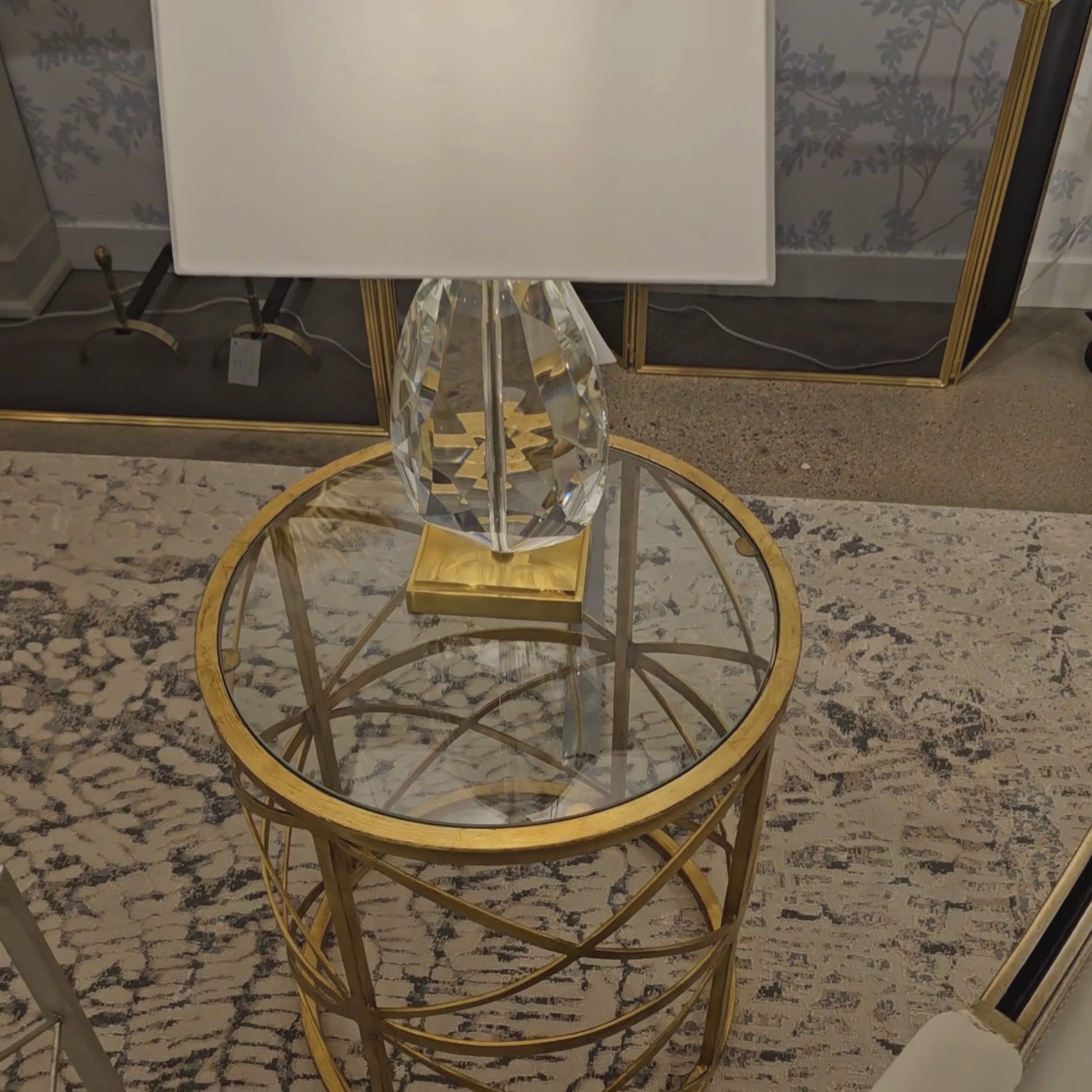 Gold side table with crystal lamp.
