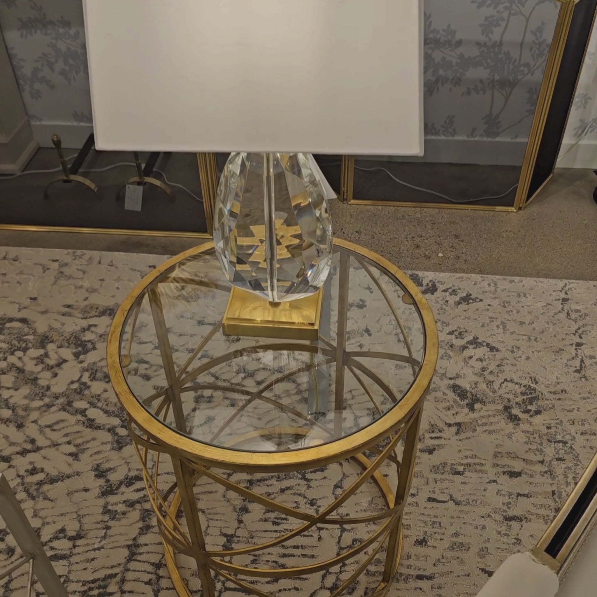 Gold side table with crystal lamp.