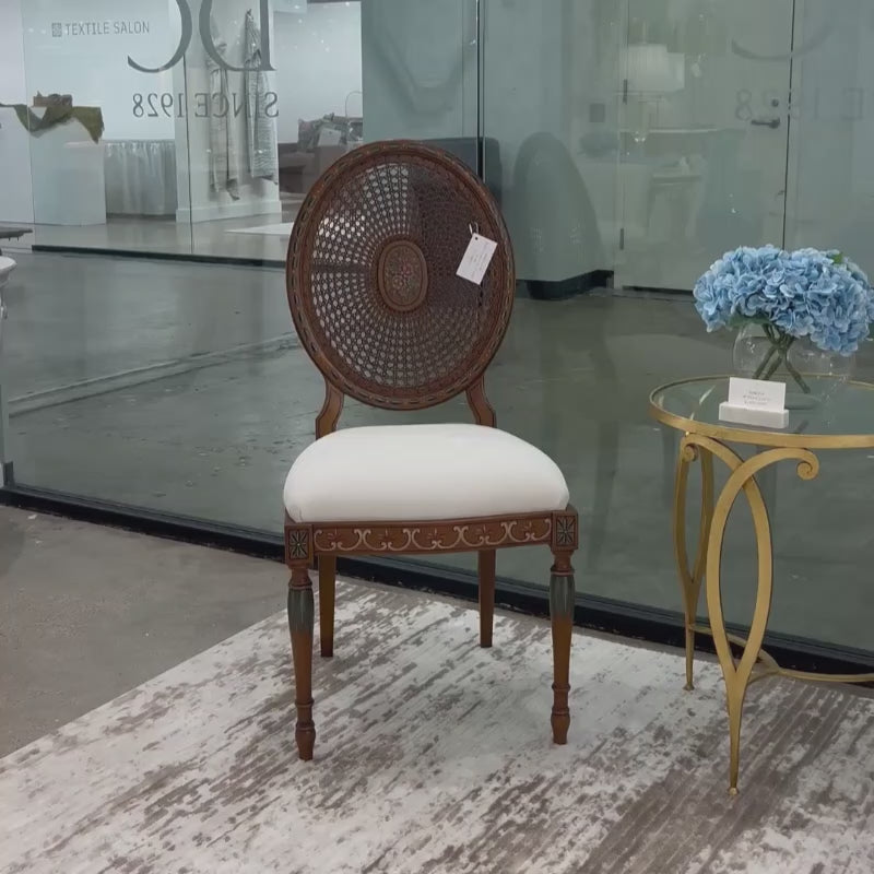 Traditional brown Italian cane chair with hand painted details.