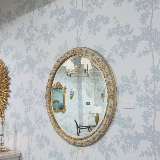 Traditional white Italian mirror with gold details.