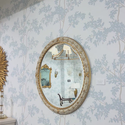 Traditional white Italian mirror with gold details.