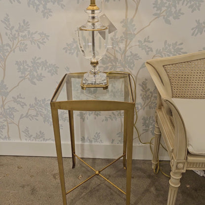 Gold accent table with crystal lamp.