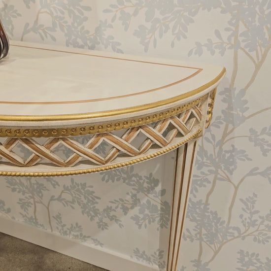White and gold console table.