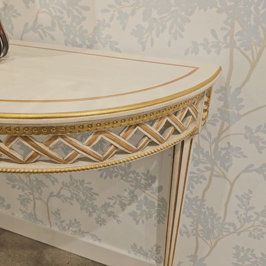 White and gold console table.