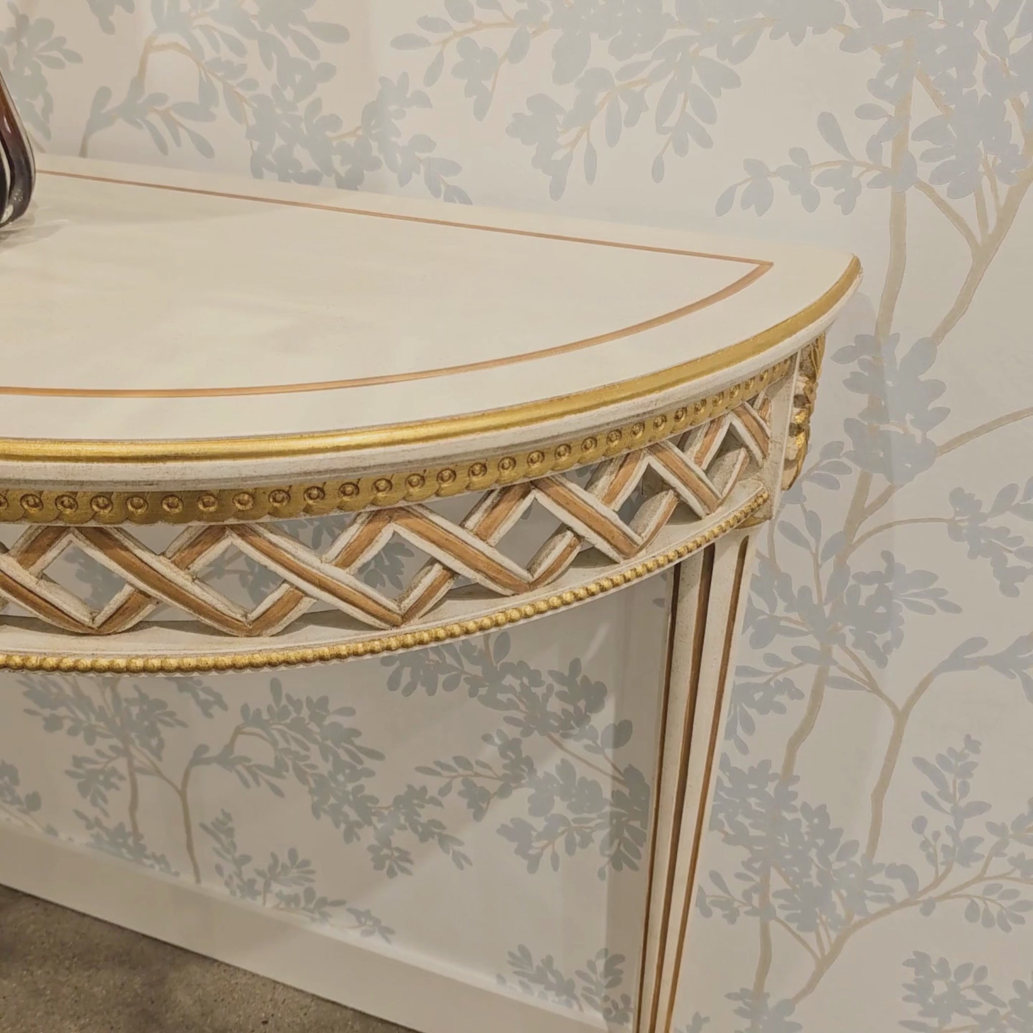 White and gold console table.