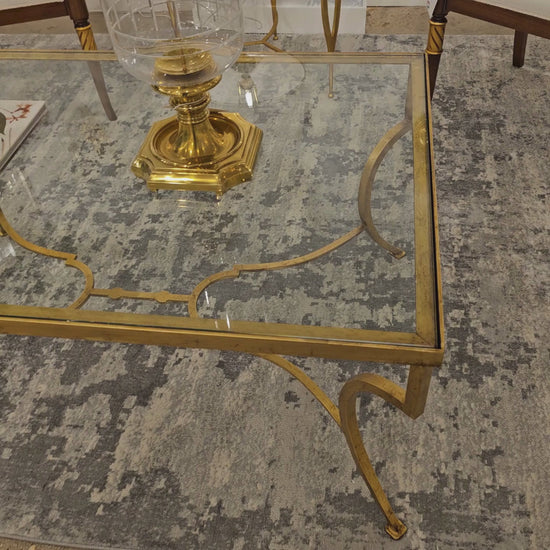 Gold leaf coffee table with glass top.