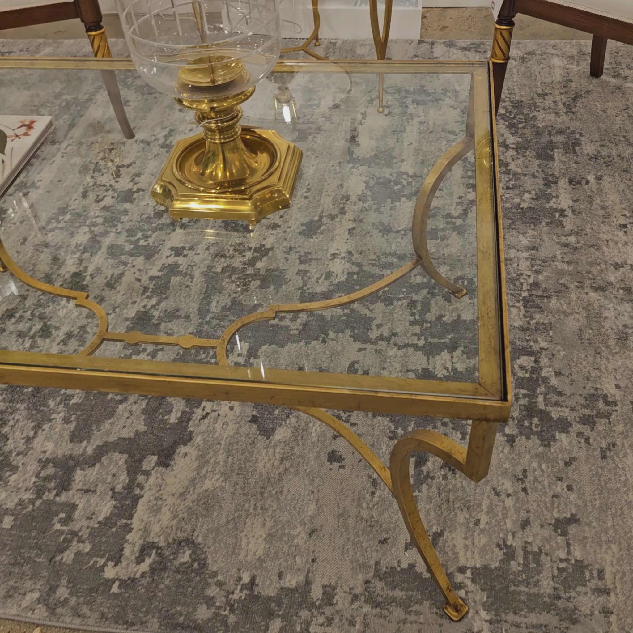 Gold leaf coffee table with glass top.