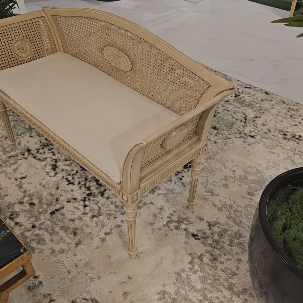 A white cane bench.