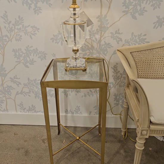 Gold Italian table with crystal lamp.