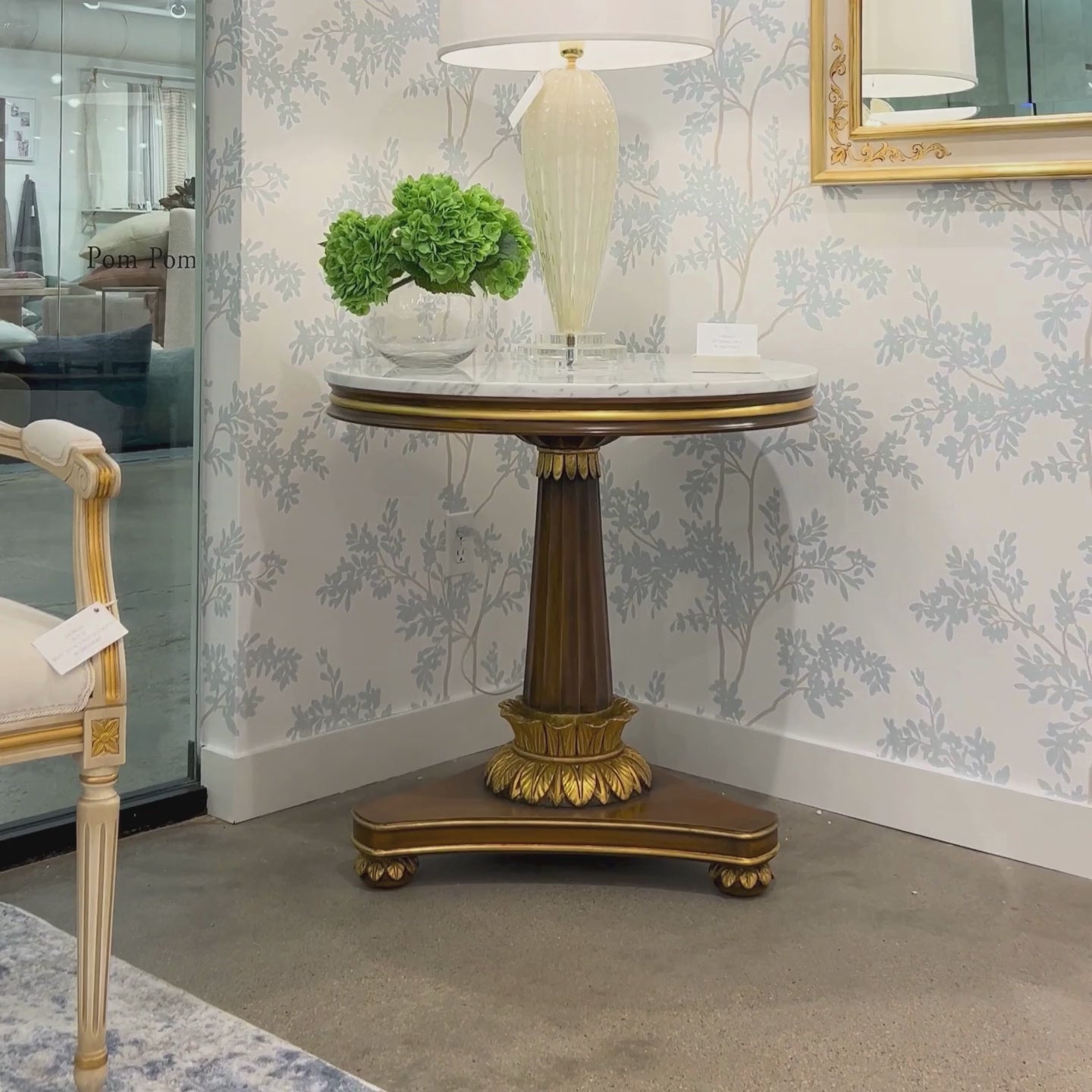 White Italian table with gold accents.