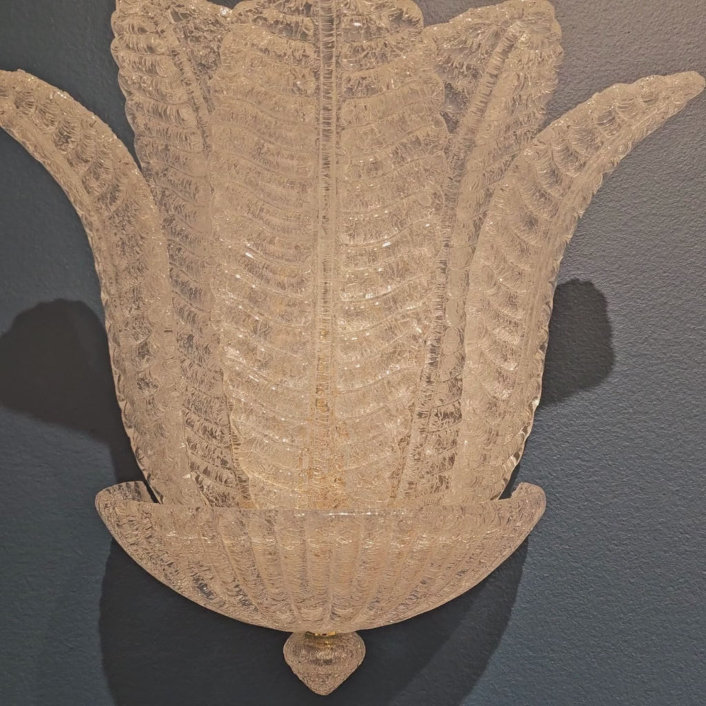Luxurious sconce made with Italian glass leaves.