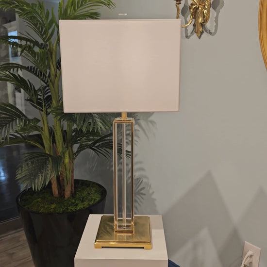 Crystal and brass table lamp with square white shade.