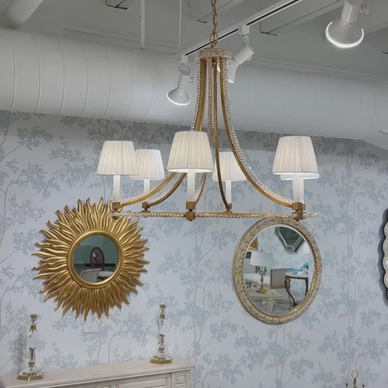 Gold Italian chandelier with crystals.