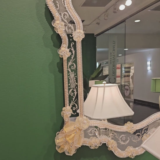 Ornate decorative gold Murano glass mirror.