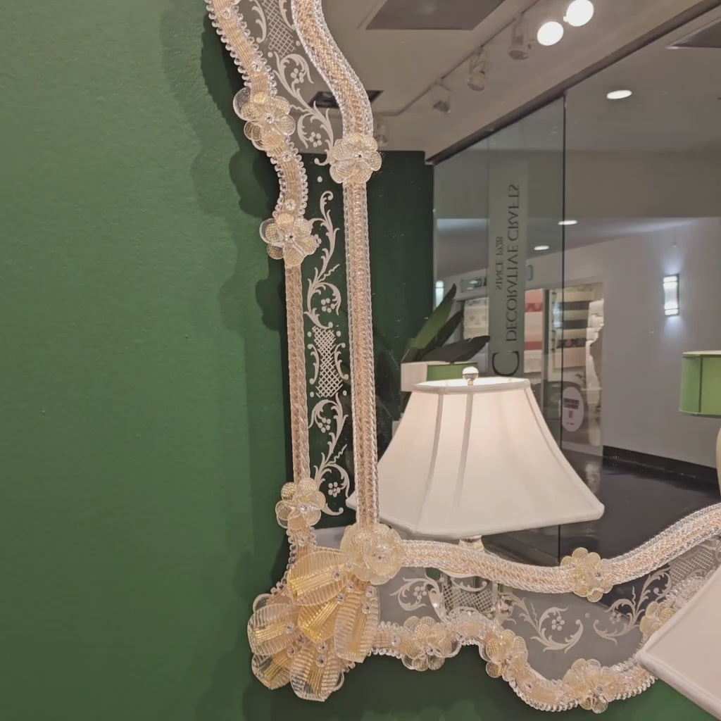 Ornate decorative gold Murano glass mirror.