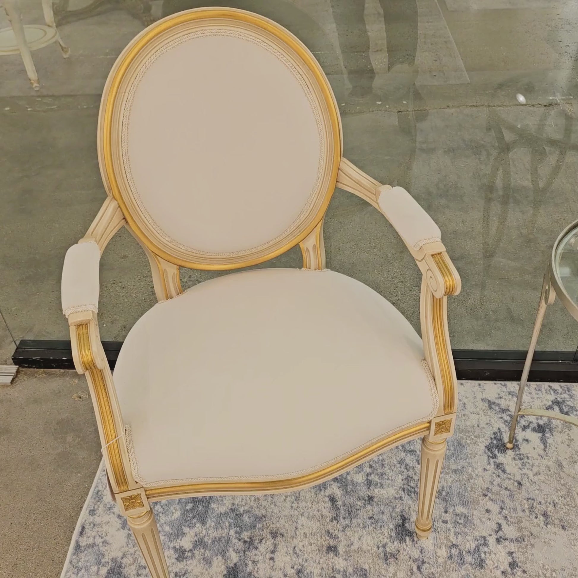 White and gold Italian upholstered armchair.