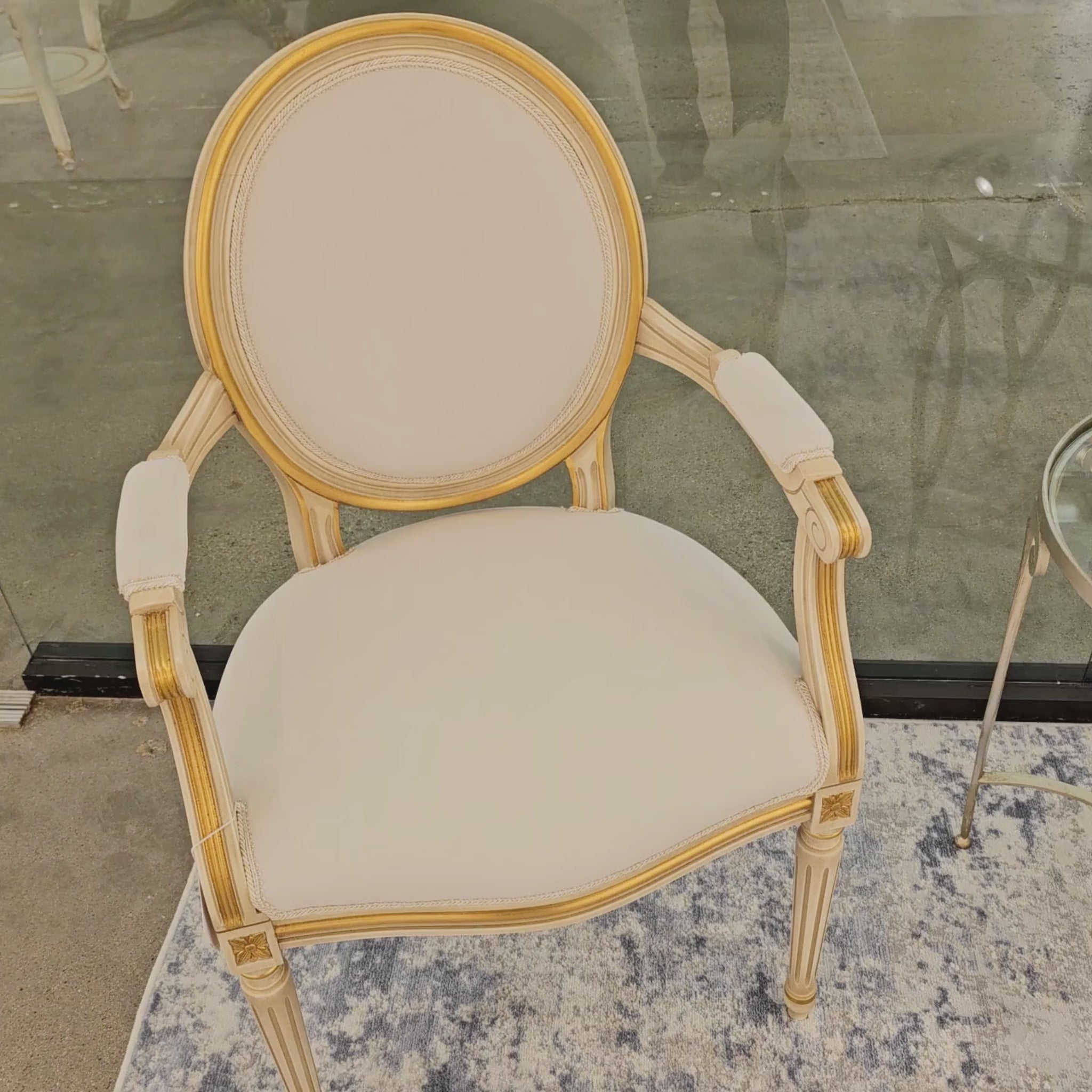 White and gold Italian upholstered armchair.