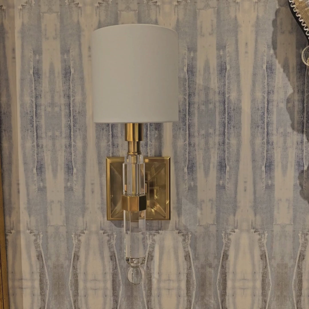 An antique brass sconce.