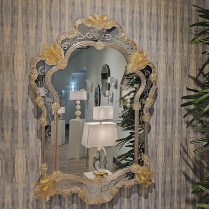 Clear and gold Murano glass mirror.