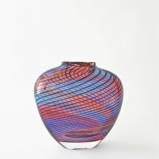 Blue and red glass vase with striped design.