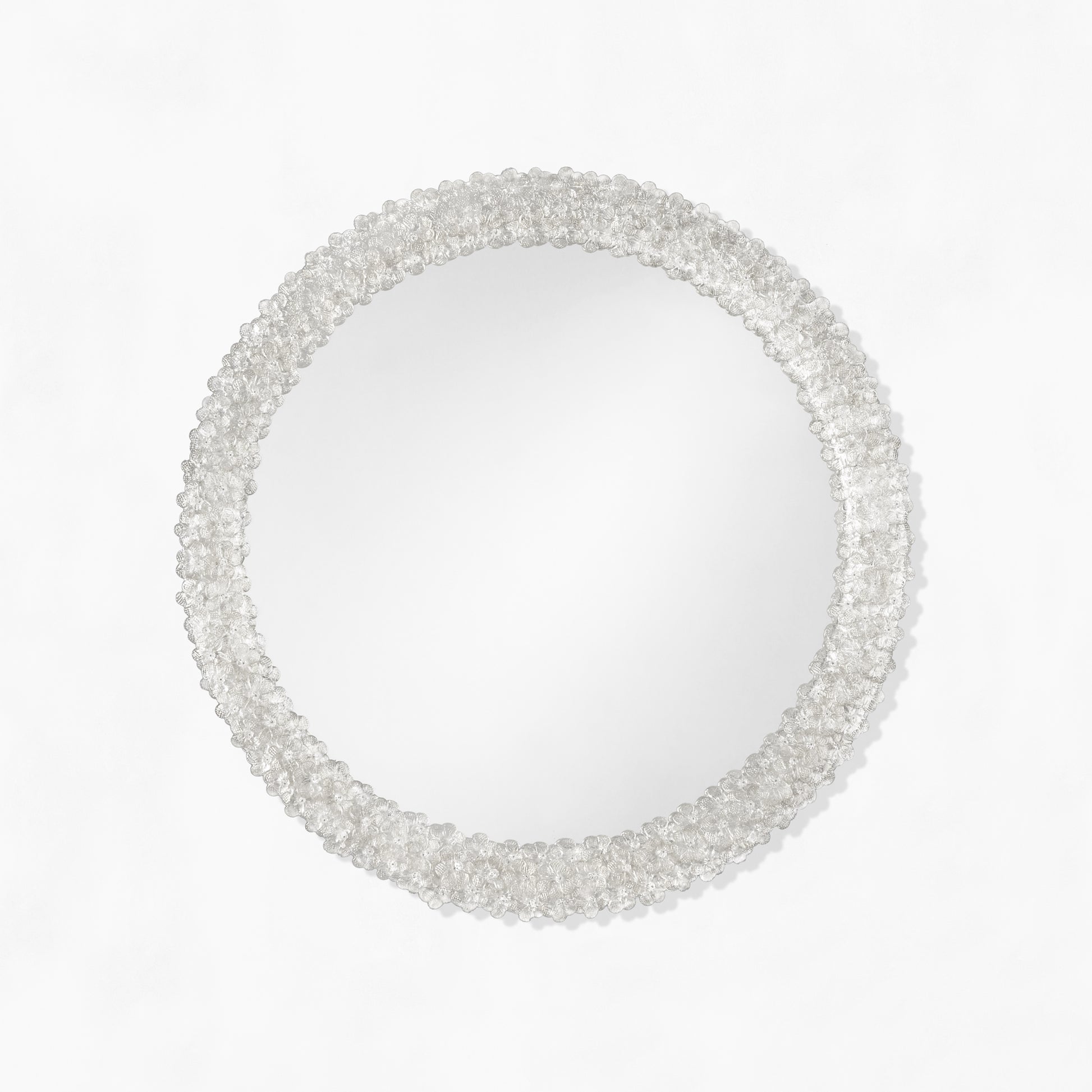 Clear round Murano glass mirror.