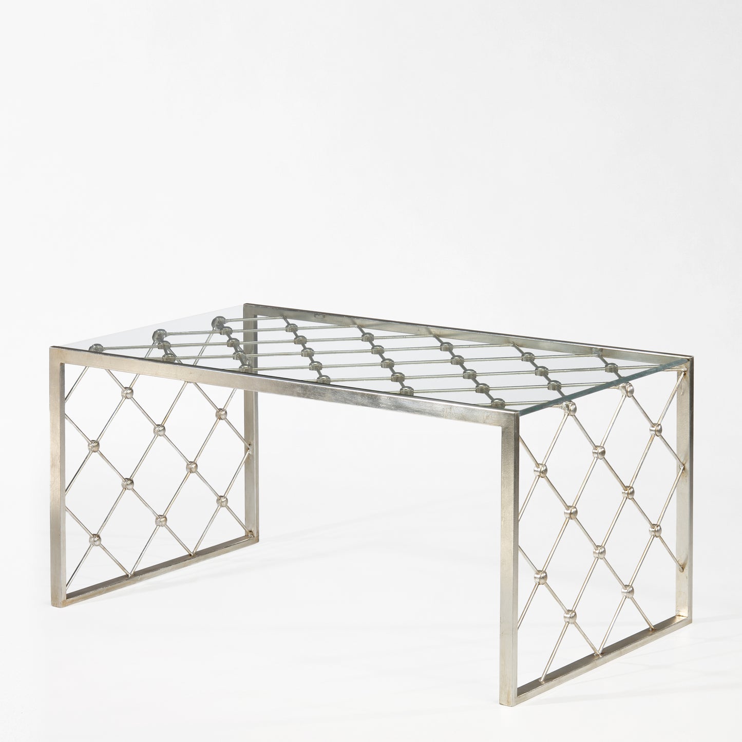 Silver coffee table with glass top.