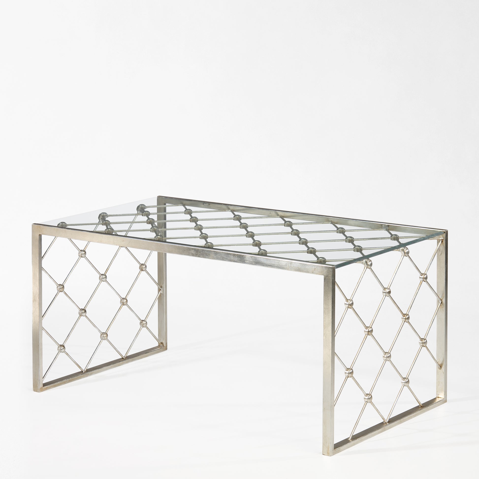 Silver coffee table with glass top.