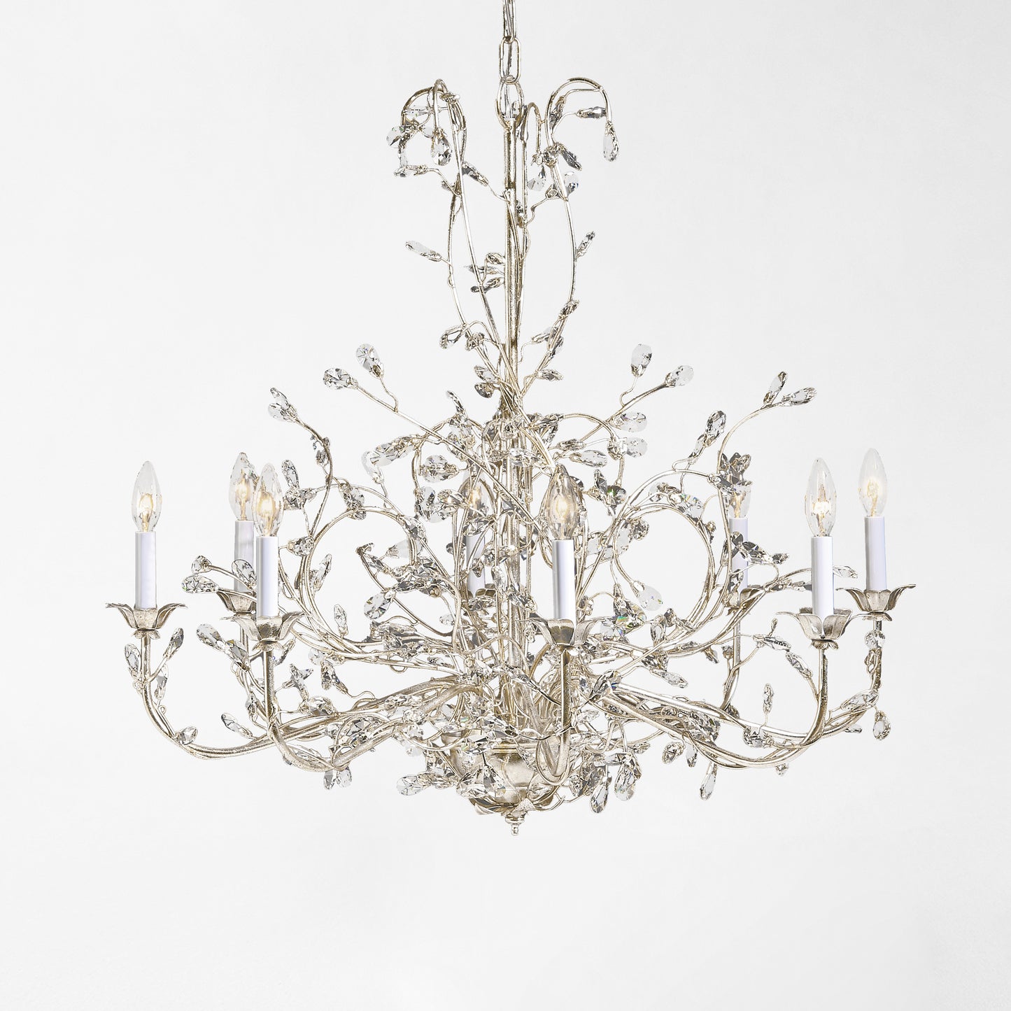 Iron chandelier with silver leaf finish and crystal drops.