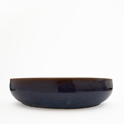 Dark blue ceramic decorative bowl.