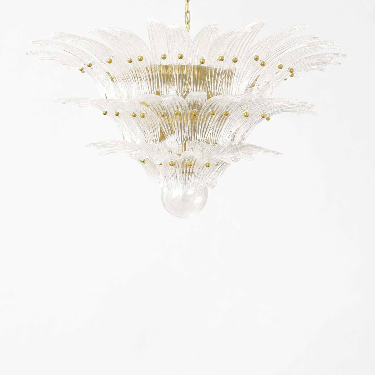 Clear Palm Murano glass chandelier with gold hardware.