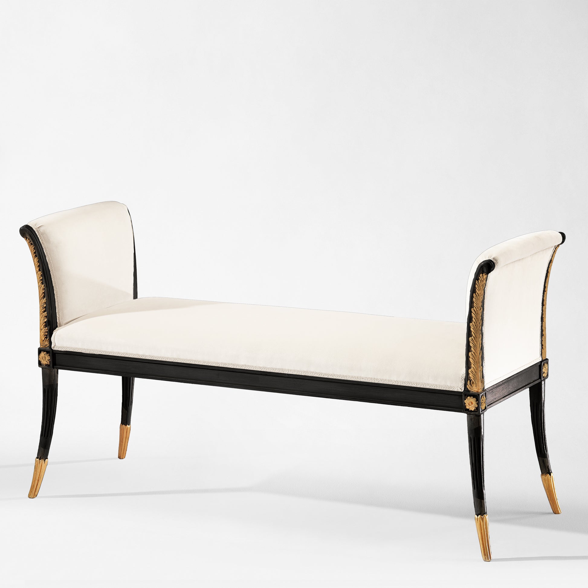 Traditional Italian black bench with gold details and white fabric.
